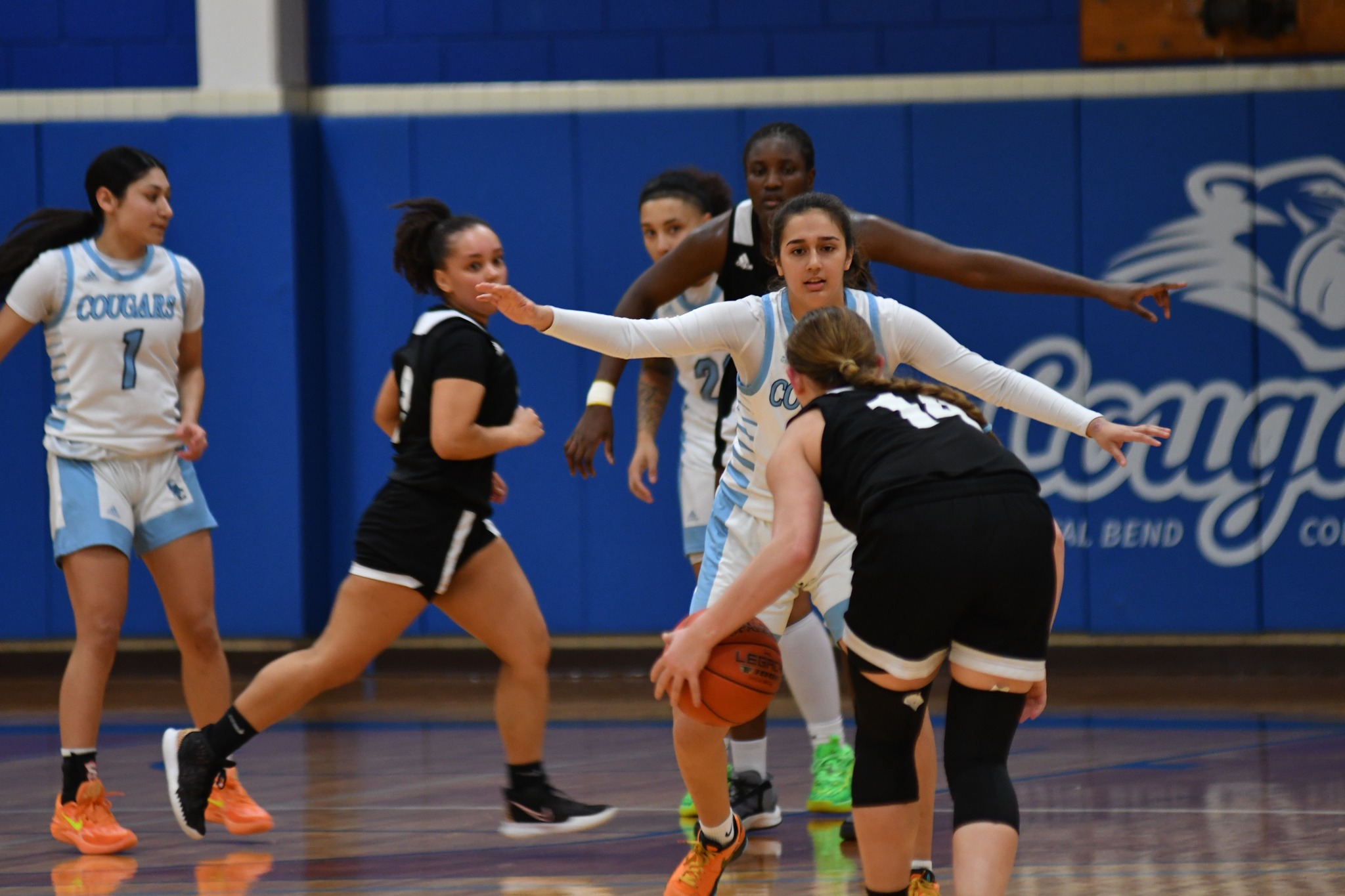 Cougars Fend Off Jaguars to Win First Conference Game
